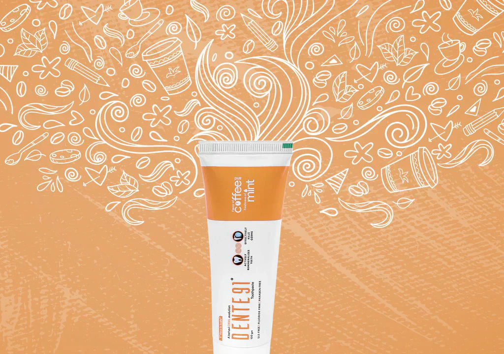 Dente91 coffee mint toothpaste tube with coffee-themed doodles on orange background