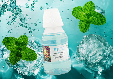 Dente91 cool mint mouthwash bottle with fresh mint leaves and ice in water background